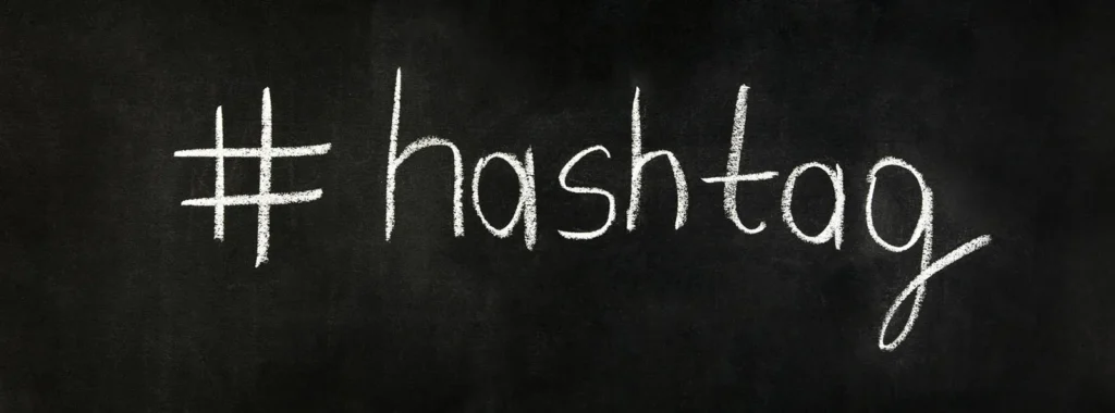 The word '#hashtag' written in chalk on a blackboard